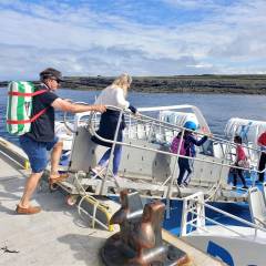 Passengers boarding Aran Islands Express ferry at Doolin Pier